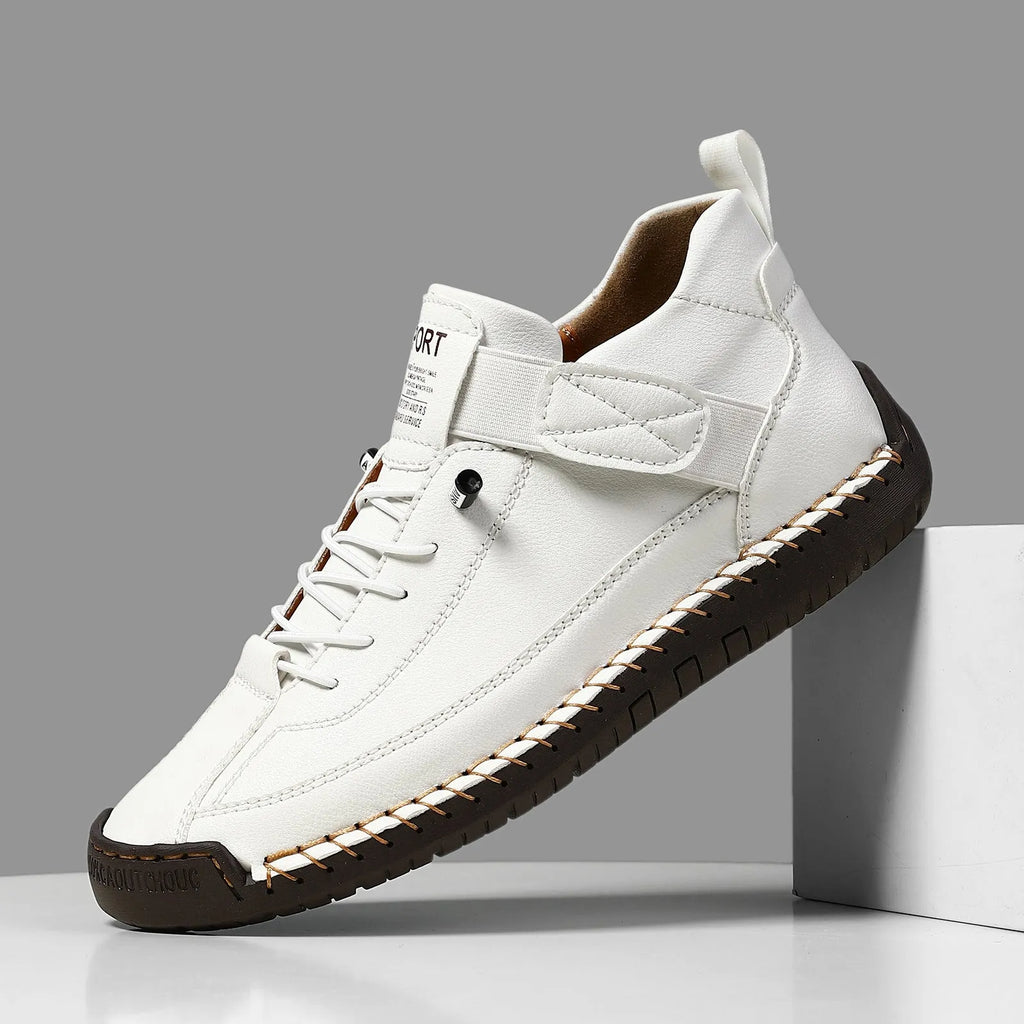 Men's mid-top Martin boots in multiple colours with elastic band and tooling stitching detail.