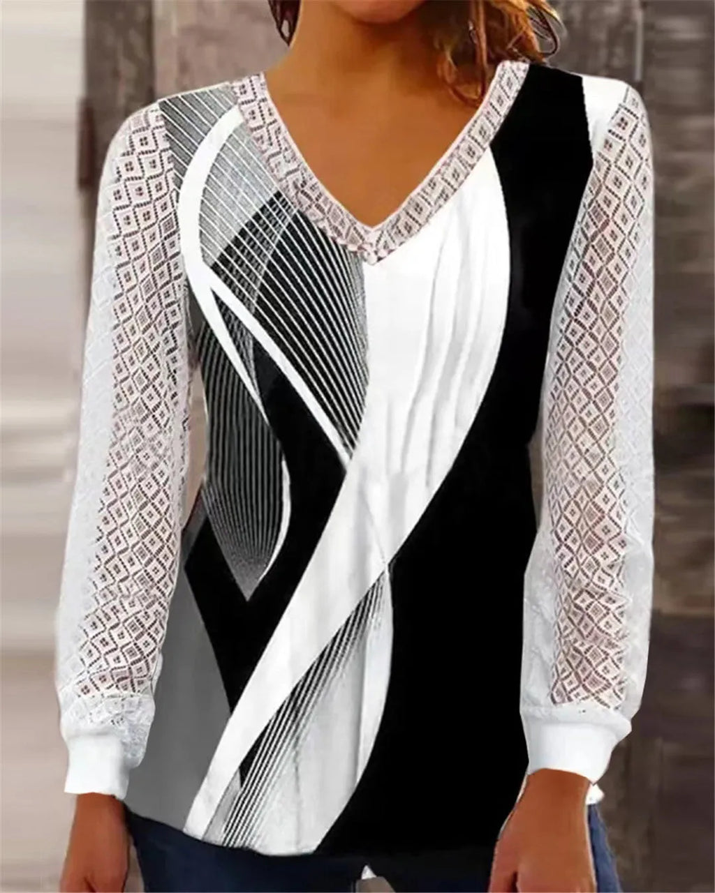 Loose fit V-neck lace top with hollow-out details in polyester fabric