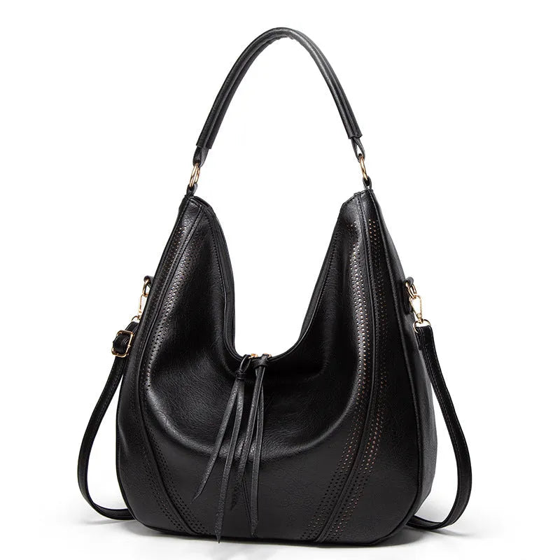 Women's soft PU leather tassel hollow shoulder bag in vertical square shape with sewing line details, black colour
