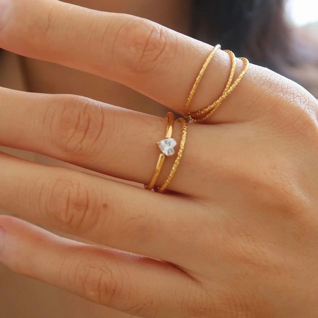 Golden love oval ring in stainless steel with electroplated finish showing heart design