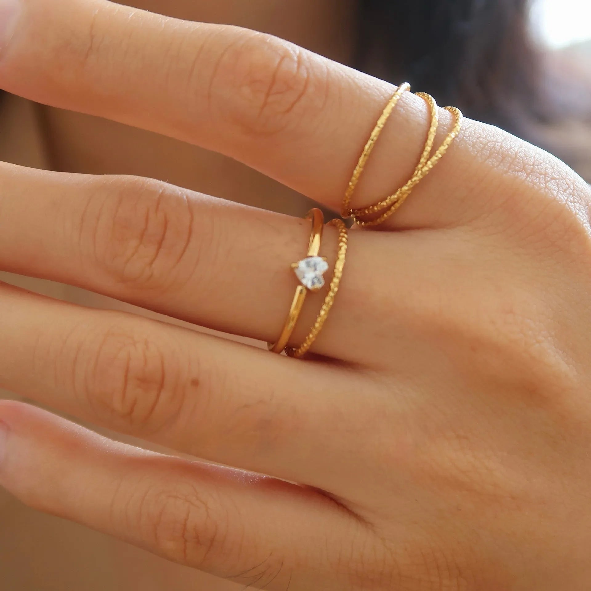 Golden love oval ring in stainless steel with electroplated finish showing heart design