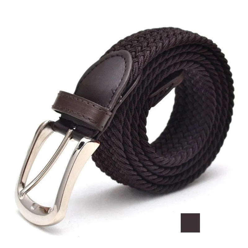 Unisex braided elasticated canvas belt in beige with alloy buckle, shown on a wooden surface