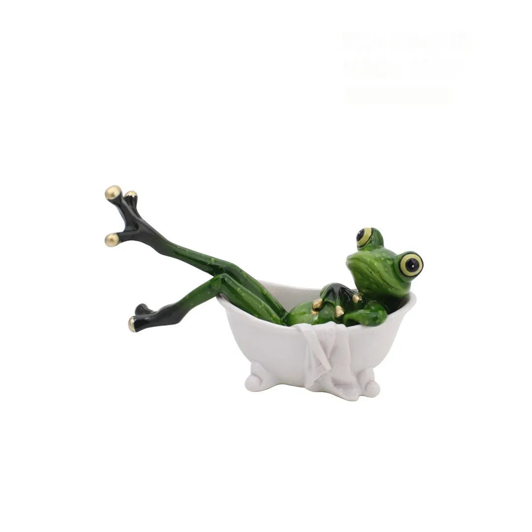 Synthetic resin pastoral style frog figurine home decoration ornament on a surface.
