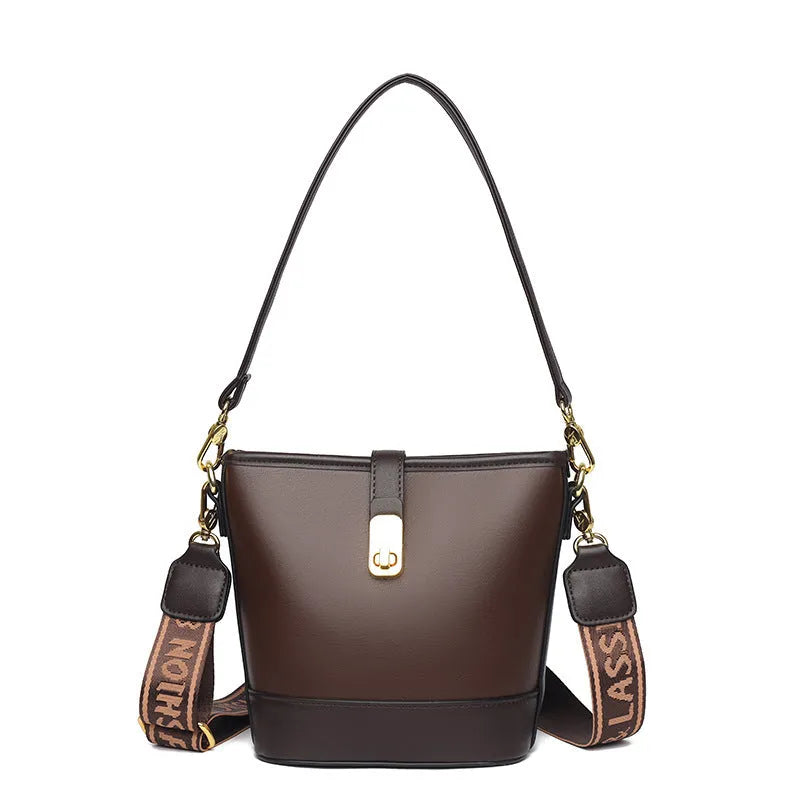 Korean-style black bucket messenger bag showing zipper compartments and adjustable shoulder straps