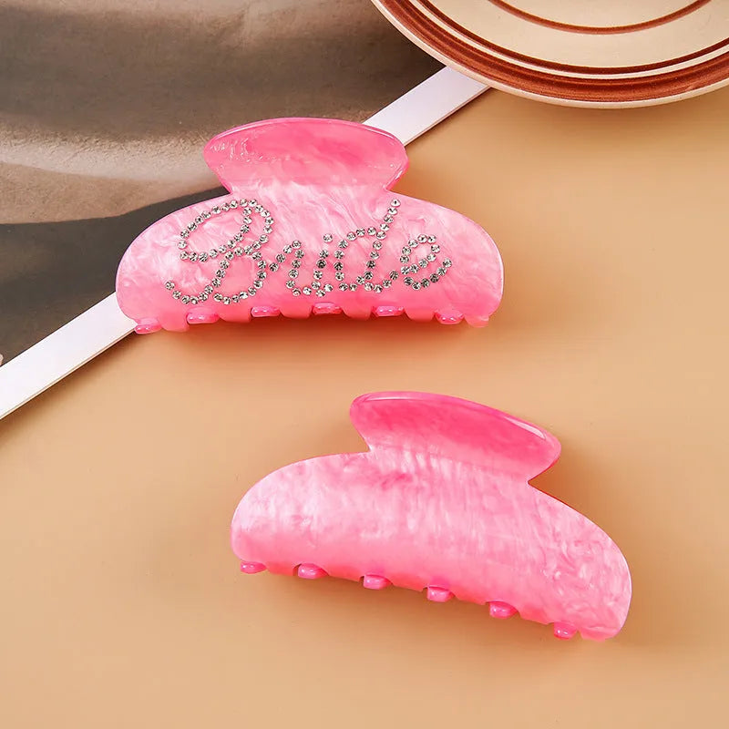 Pink and white 10cm acrylic shower hair clip with spot drill and letter decoration.