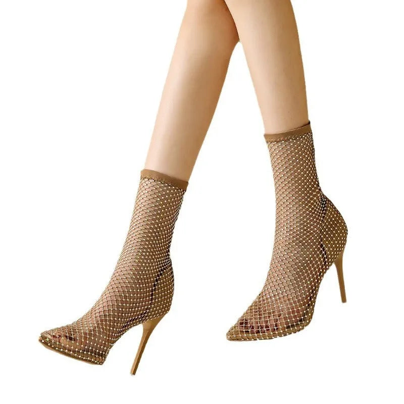 Gold women's high heel sandals with pointed toe, stiletto heel, and mesh upper.