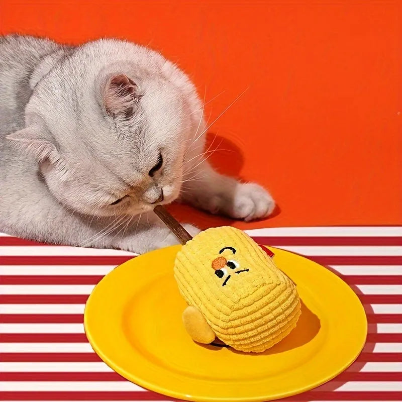 Corn cob shaped cat toy made from natural polio wood on a white background.