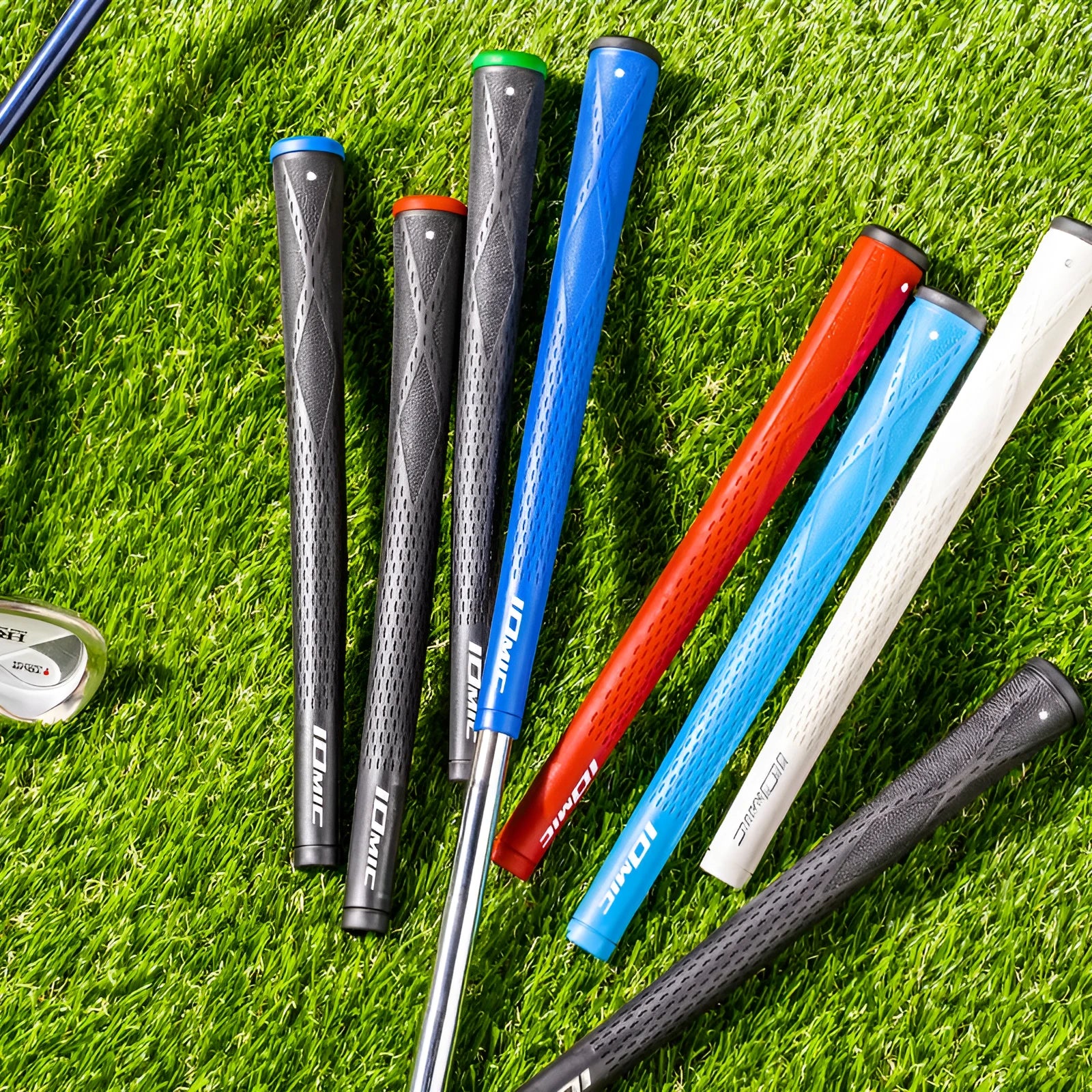 TPE golf club grip showing non-slip texture in multiple colour options including pink, blue, white and two-tone combinations