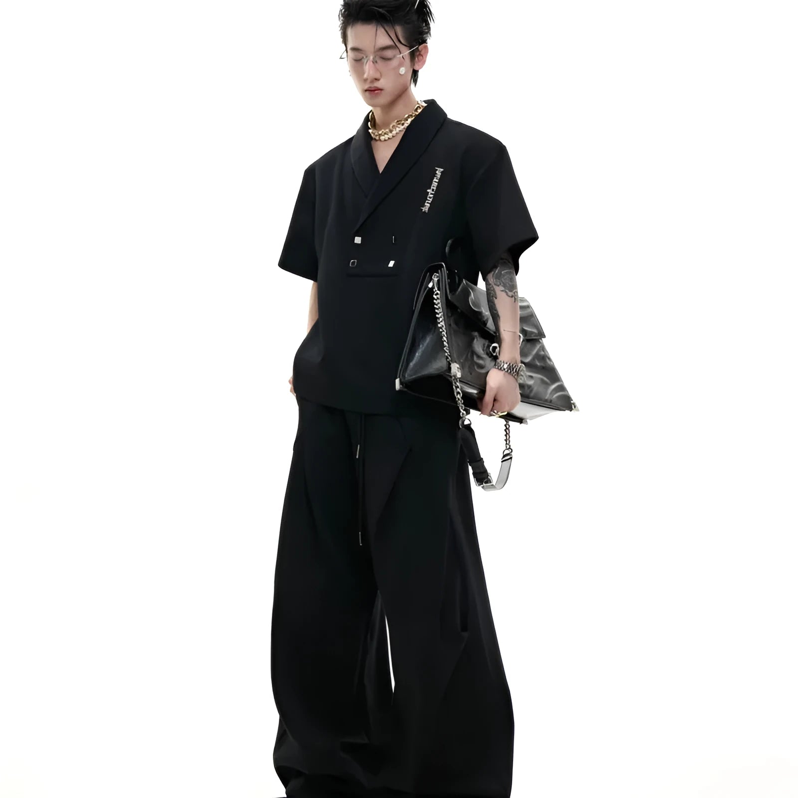 Men's dark grey cotton sports suit with V-neck short sleeve top featuring padded shoulders and metal embellishments with matching shorts