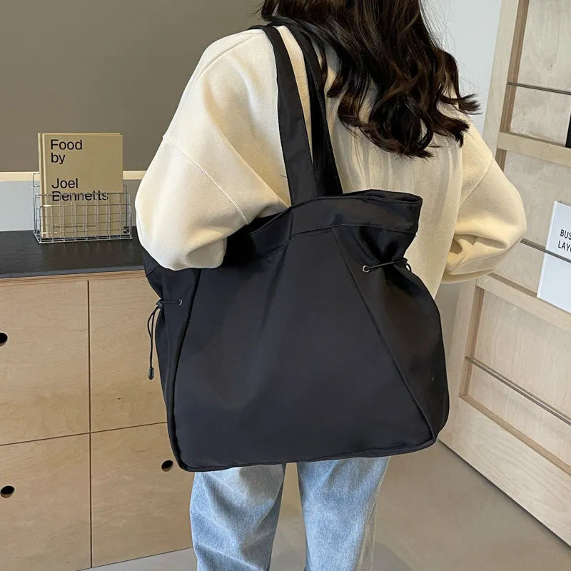 Soft Oxford cloth folding tote bag shown in multiple colours: black, brown, grey, and purple.