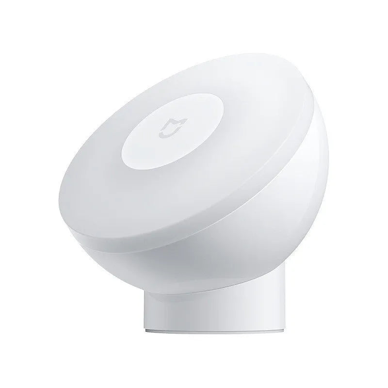 White modern Mijia induction bedside lamp with compact cubic design on a table.