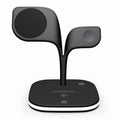 Black and white wireless charging station for phone, watch and headphones on a desk