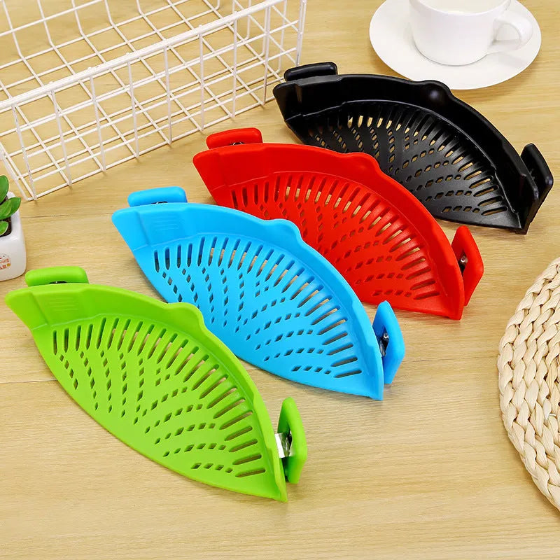 Silicone clip-on kitchen strainer with stainless steel mesh attached to cooking pot