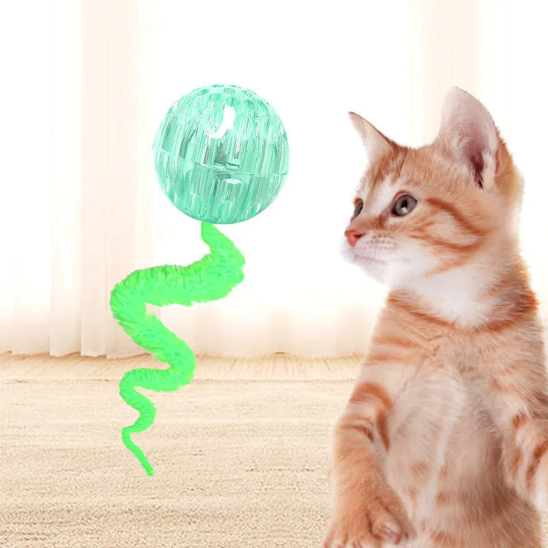 Green interactive bouncy ball cat toy with plush tail for indoor play
