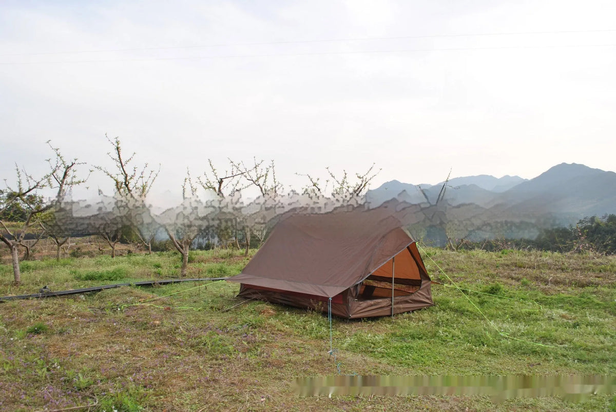 Brown A-line pole-free cabin tent set up with hiking poles showing spacious interior for 2-3 campers