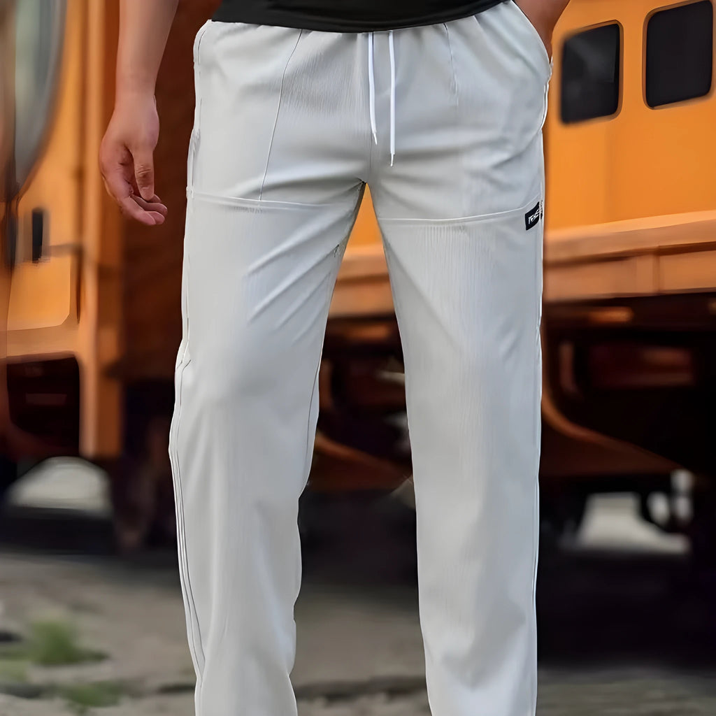 Men's light grey polyester casual trousers laid flat showing front design.