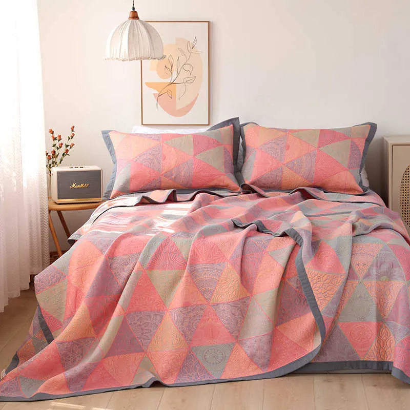 Cotton gauze bedding three-piece set showing botanical flower pattern on blanket and matching pillowcases