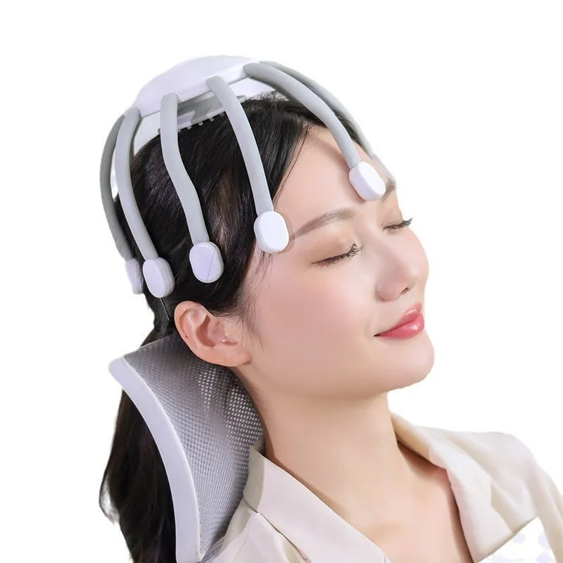 Black or white USB head massager with multiple claws for scalp vibration.