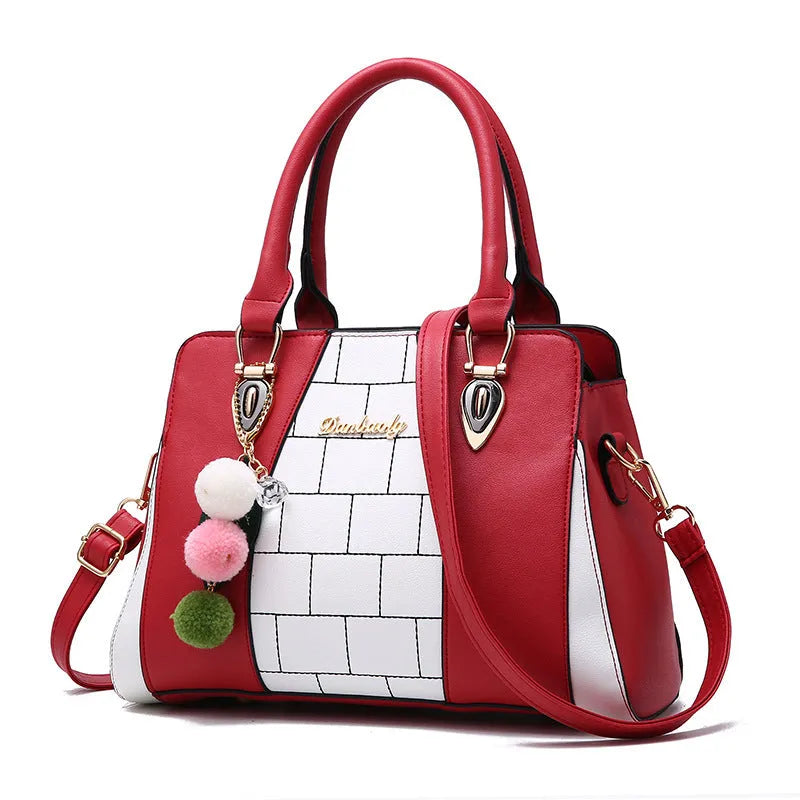Contrasting colour handbag in PU fabric with zipper closure, size 29 cm by 13 cm by 20 cm