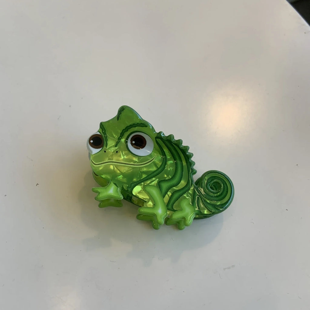 Colourful dinosaur acrylic jaw clip hairpin showing grip design with dinosaur motif