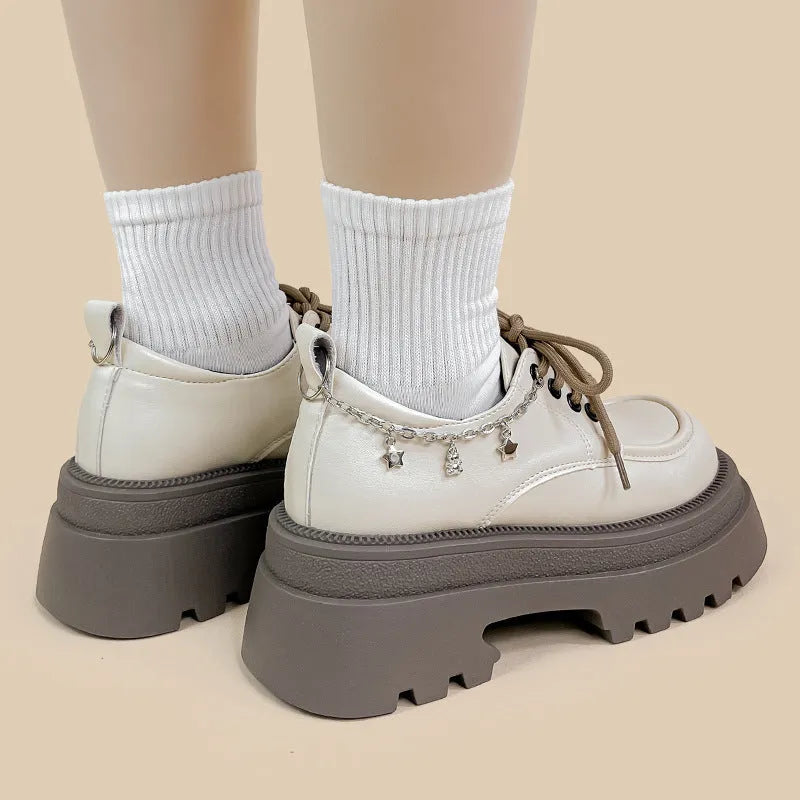 White platform Mary Jane leather shoes with chunky heel and lace-up closure