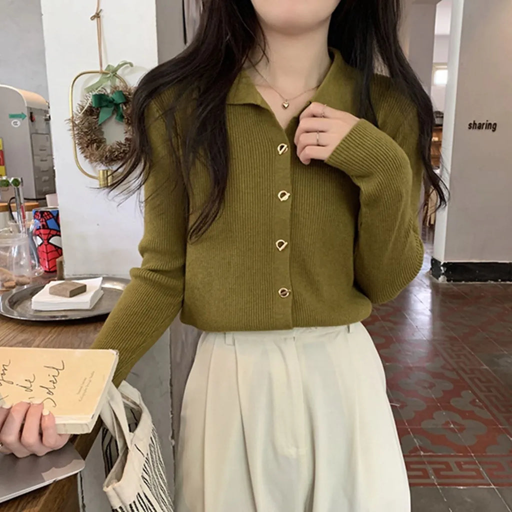 Beige loose-fit long-sleeve viscose knitted cardigan shown on a hanger.