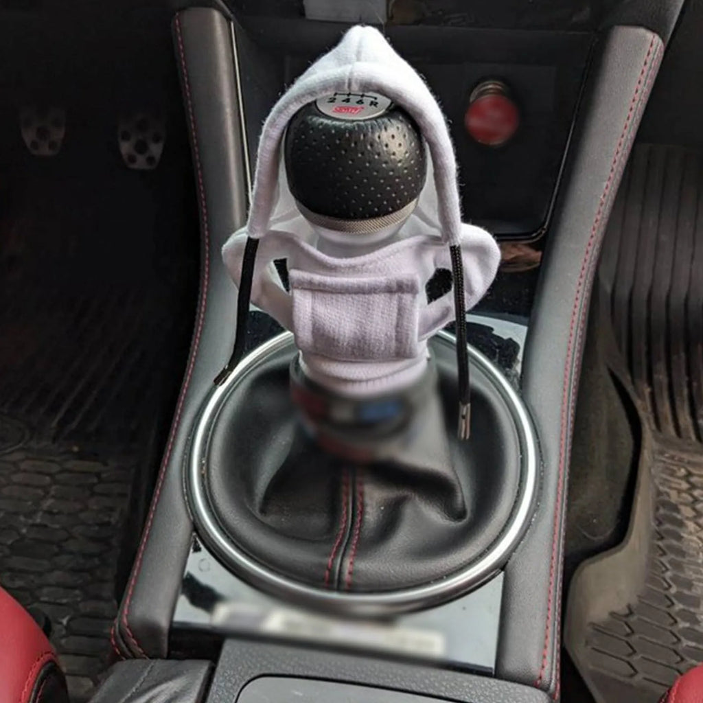 Universal cotton gear knob cover hoodie in blue with adjustable drawstring on a car shift knob