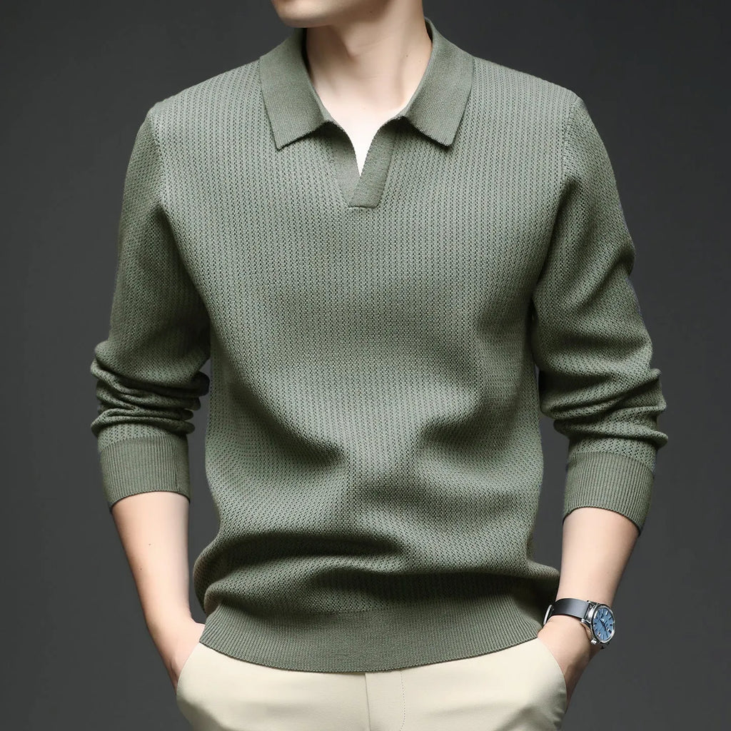 Man wearing a loose green casual pullover sweater, showcasing its autumn leisure style.