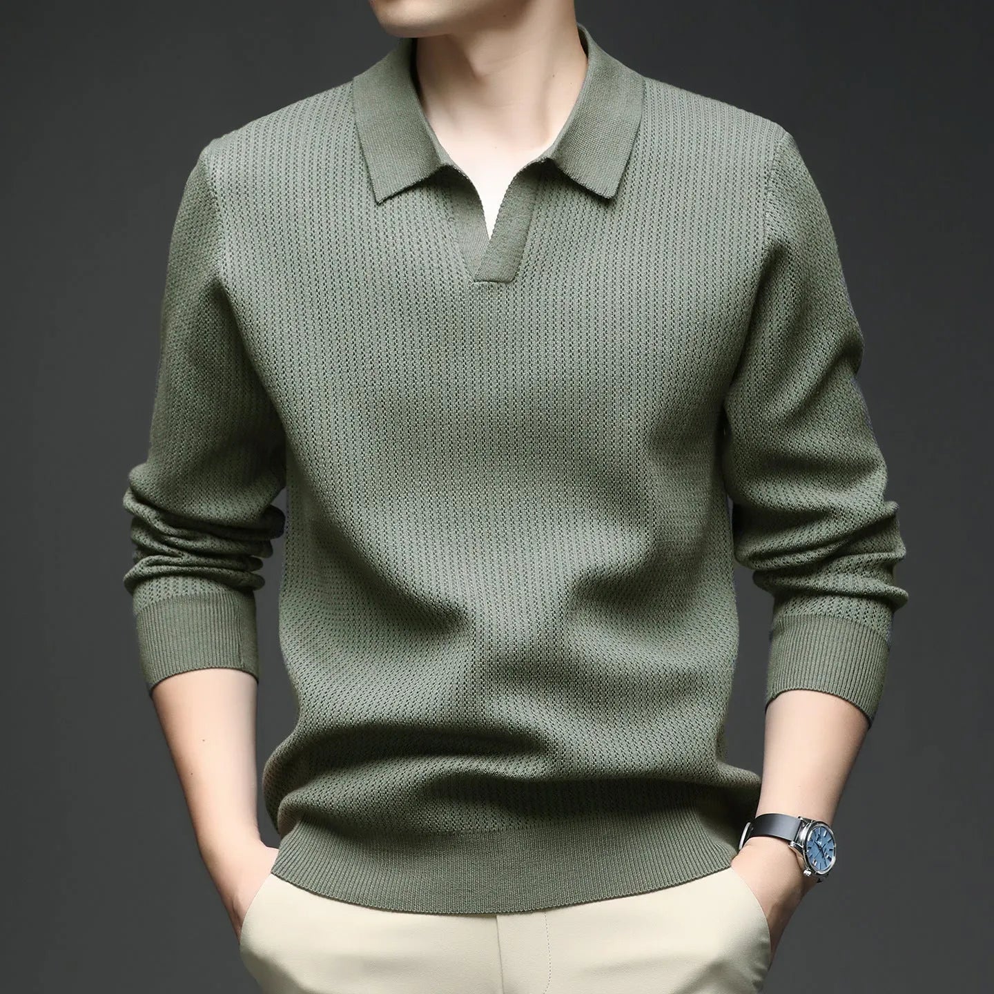 Man wearing a loose green casual pullover sweater, showcasing its autumn leisure style.