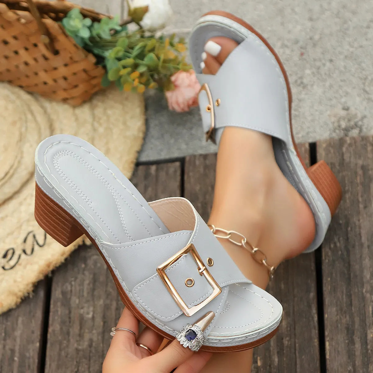 Women's black and light blue chunky heel sandals with a metal buckle and retro round-toe design.