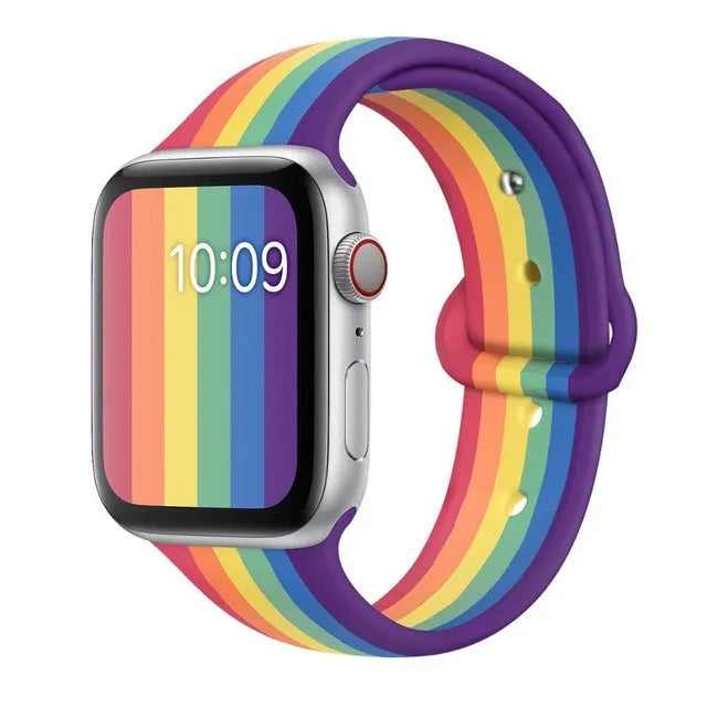 Silicone sports wristband with an adjustable buckle clasp in black, rainbow, or white.
