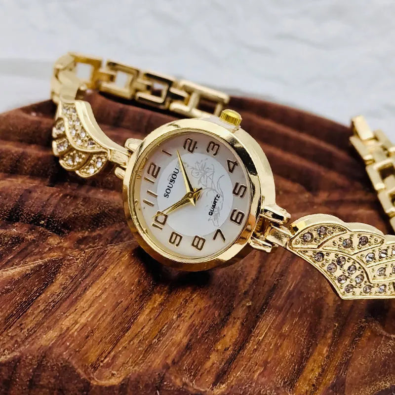 Stainless steel women's watch with round dial and vachette clasp in gold surface colour
