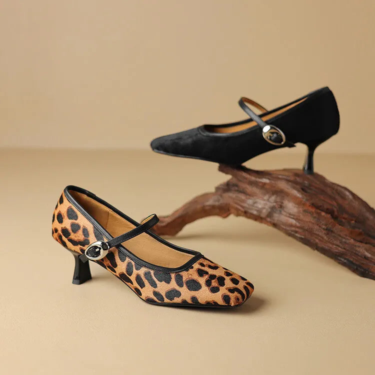 Women's black square toe stiletto ankle-strap shoes with a horse hair upper and buckle fastening.