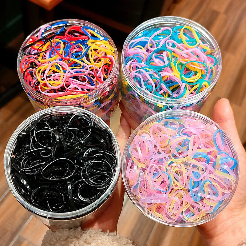 TPU baby hair ties in multiple colours stored in reusable container