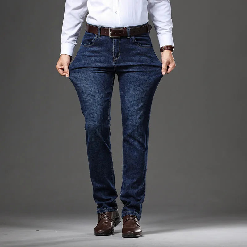 Men's black and blue stretch denim jeans showing straight-leg business casual style with mid waist and zip fly