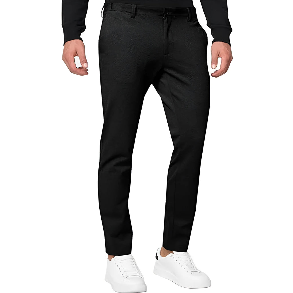 Men's slim-fit tapered chino trousers in a solid colour, showing the tapered leg and casual style.