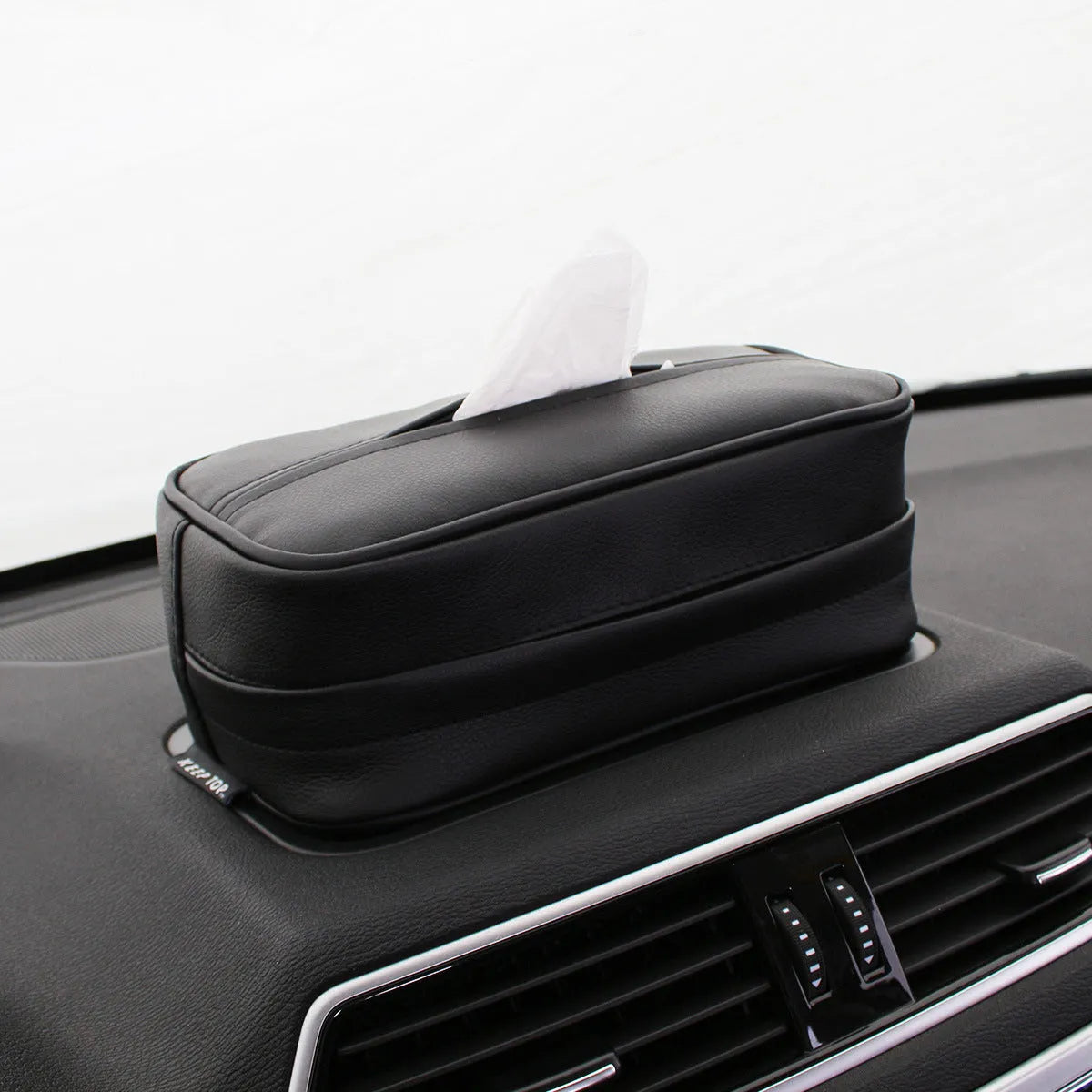 Black and beige PU leather hanging organiser box for car or home storage.