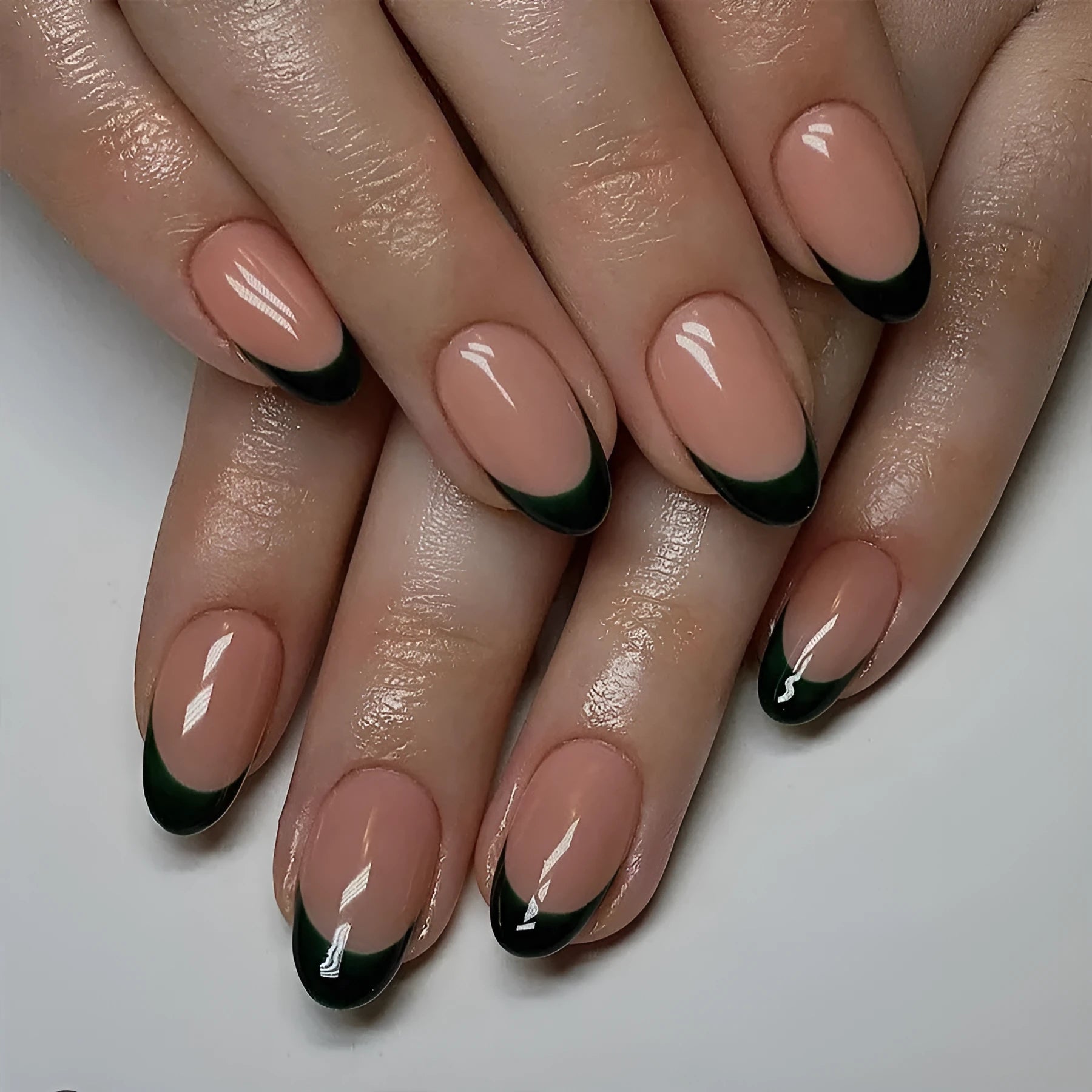24 black French style false nails with short almond shape arranged on a card