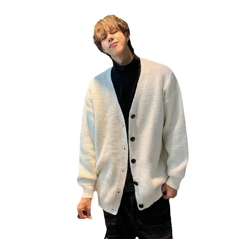 Men's loose fit V-neck cardigan sweater in a solid colour on a hanger.