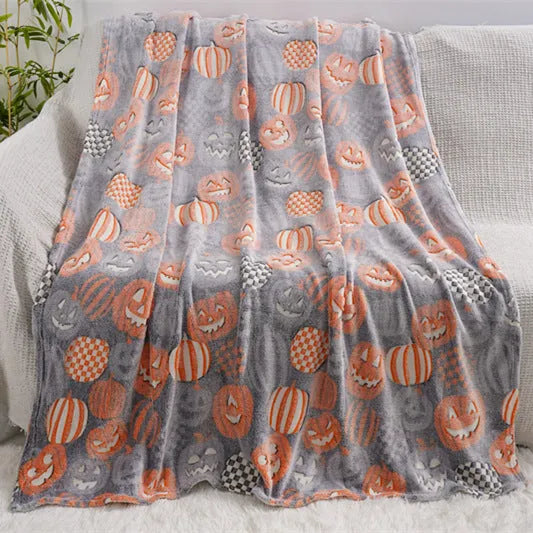 Cartoon patterned flannel blanket showing two size options for use as a child's blanket or air conditioner cover.