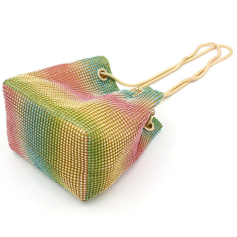 Colourful rhinestone bucket bag with glitter finish and soft fabric construction