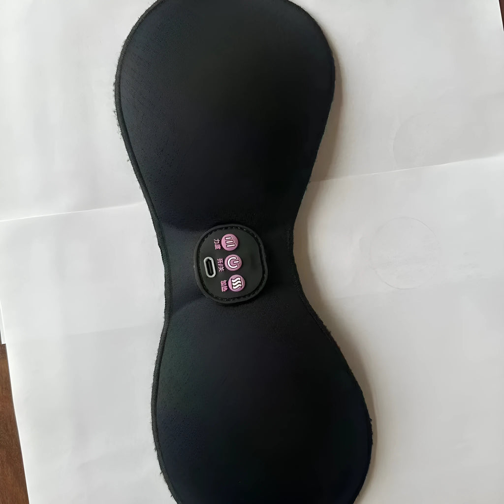 Black electric massage bra inner cushion with adhesive chest stickers and a 3-key control panel.