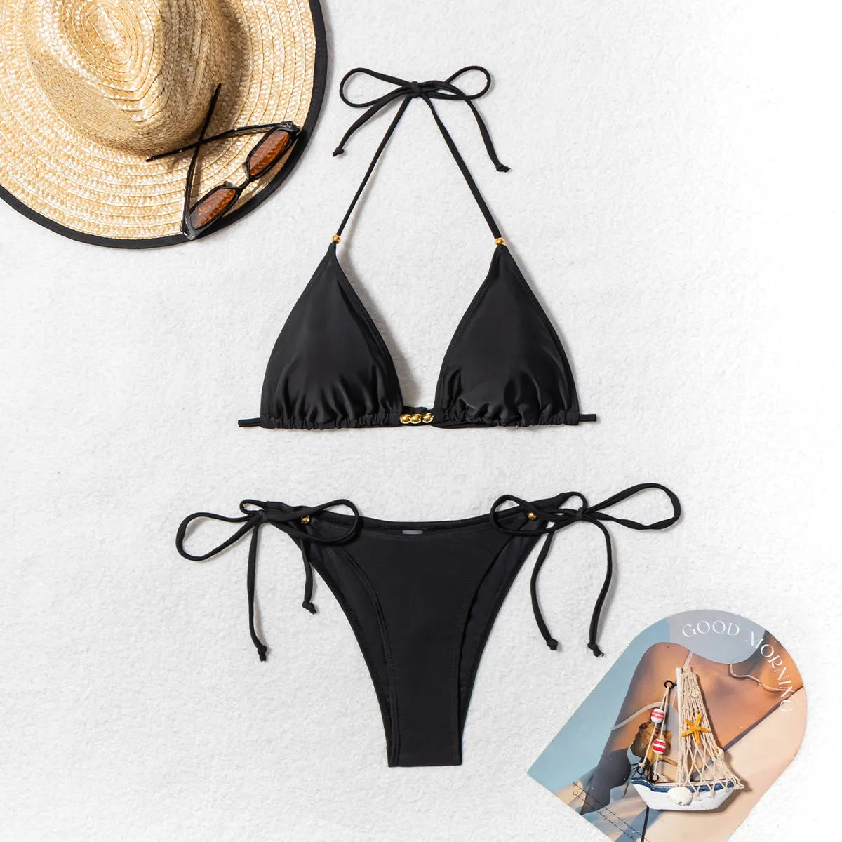 Black women's bikini swimsuit with metal bead decoration and split high-leg design