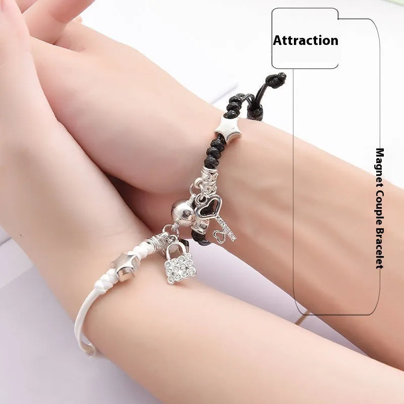 Pair of silver alloy magnet clasp couple bracelets showing example designs like clover, crown, and love symbols.