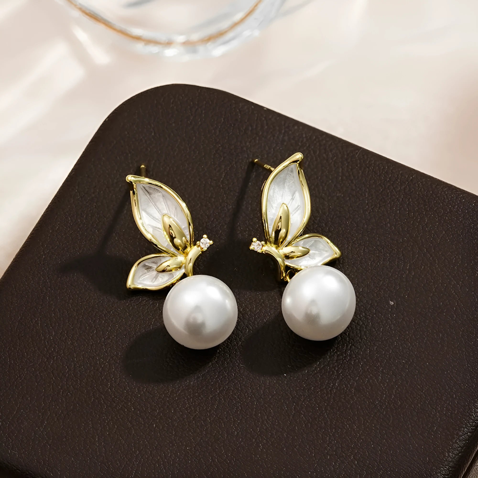 Zircon butterfly earrings for women in electroplated copper with simple geometric design