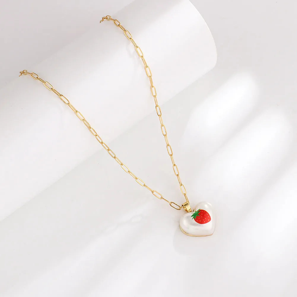 Geometric fruit pendant necklace on adjustable 21-50cm chain with strawberry, pineapple, apple, cherry, and pear colour options