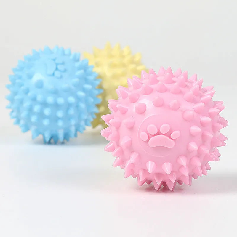 Blue TPR rubber dog toy ball with raised footprint texture for teeth cleaning, 6cm diameter.