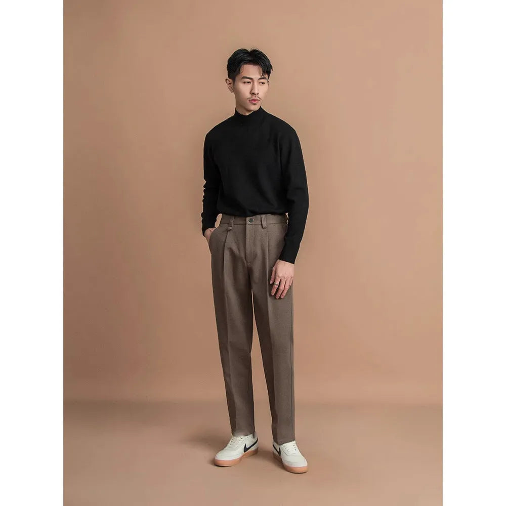 Men's straight-leg suit trousers in a draped fit, shown in a neutral colour.