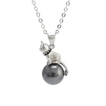 Close-up of a sterling silver cat pendant necklace on a chain with an electroplated finish.