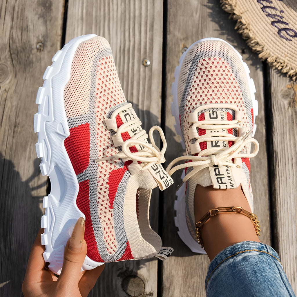Women's Flyknit mesh lace-up sneakers in various colours on a flat rubber sole.